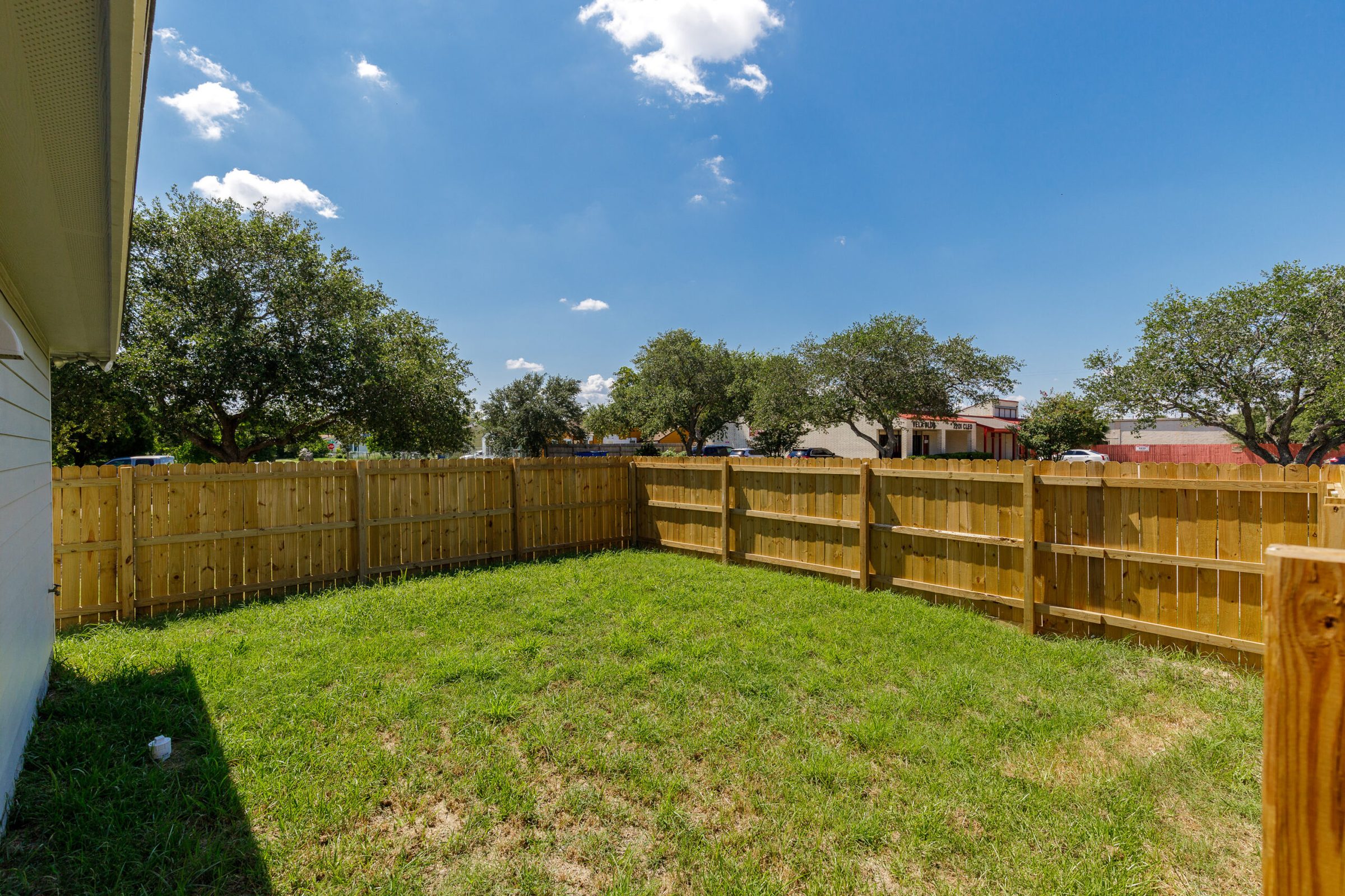 Fenced back yard at a managed duplex