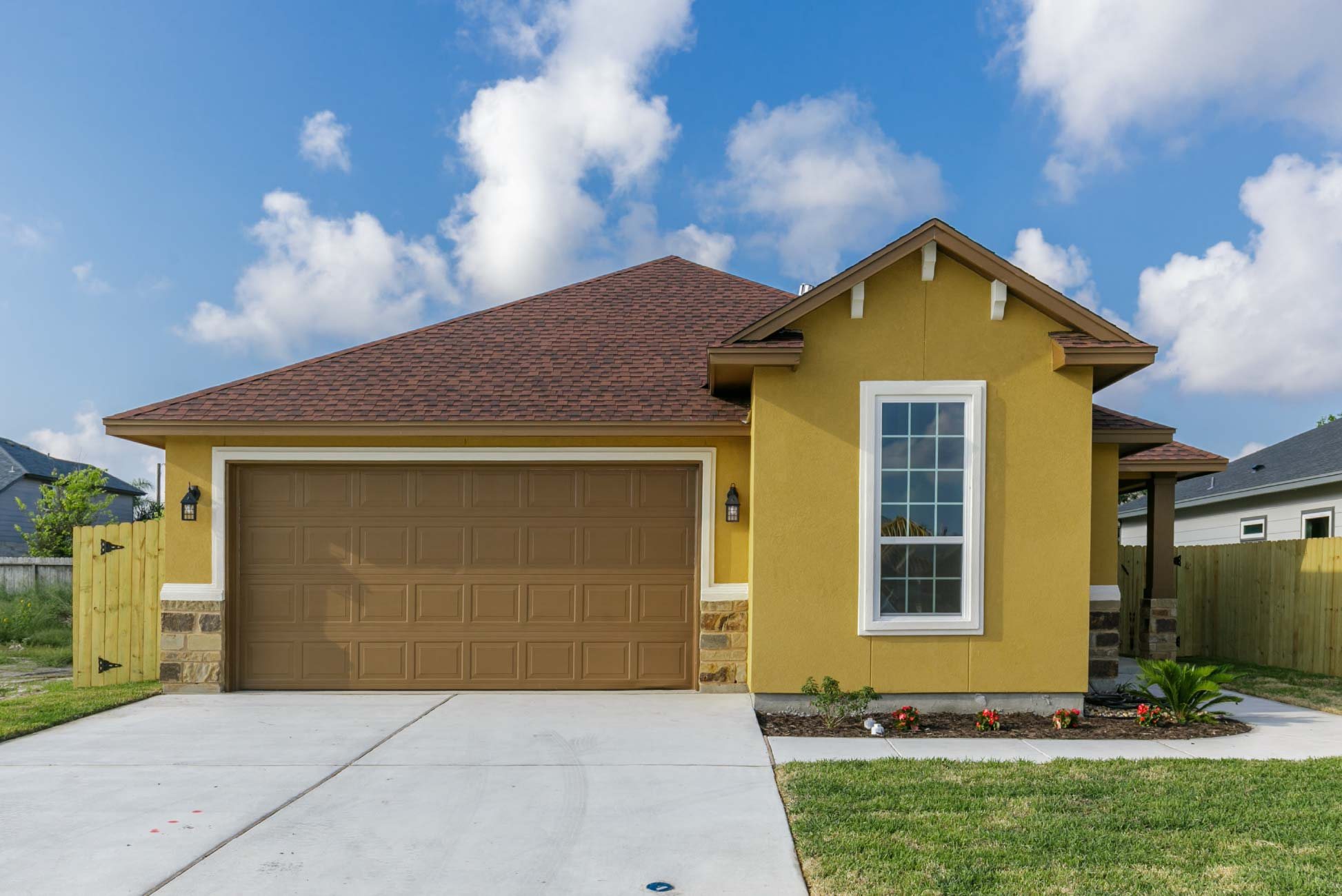 A single-family home under a bright blue sky