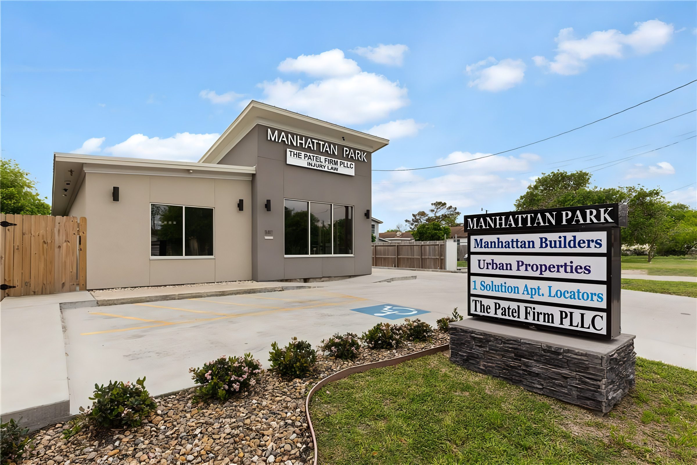 The Urban Properties office at 5117 Williams Dr, Corpus Christi, with the Manhattan Park sign